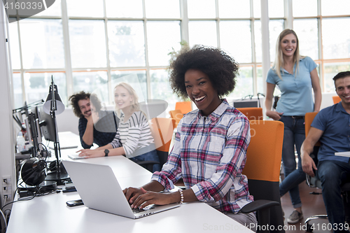 Image of African American informal business woman working in the office