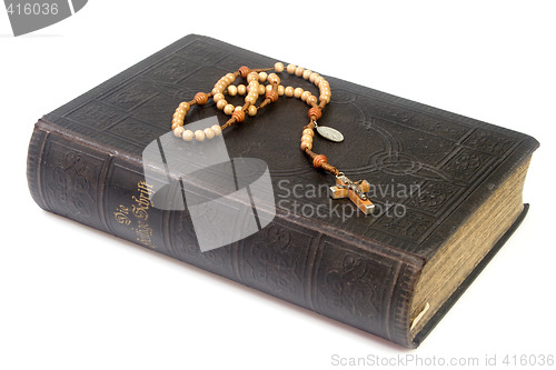 Image of Ancient bible with rosary