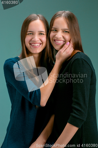 Image of Portrait of two beautiful twin young women