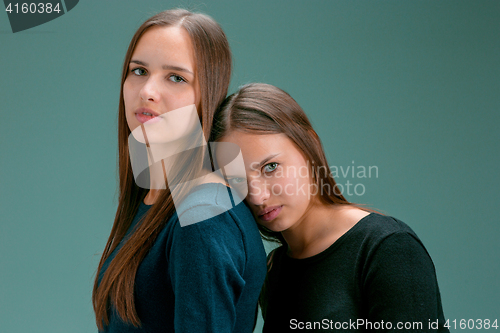 Image of Portrait of two beautiful twin young women