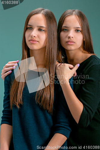 Image of Portrait of two beautiful twin young women