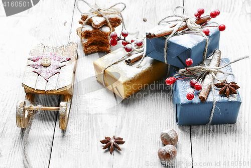 Image of Santa's sleigh and gift. Christmas card
