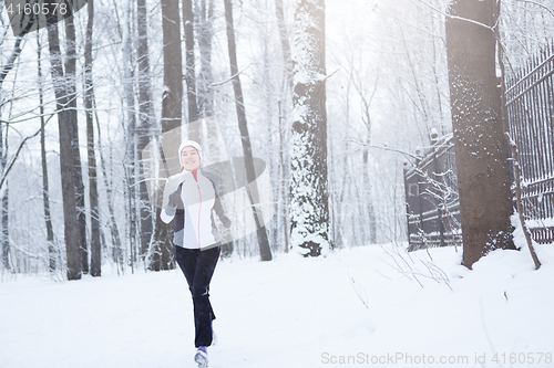 Image of Photo of young brunette running