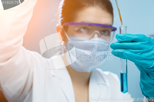 Image of Laboratory assistant with test tube