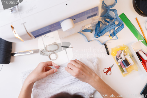 Image of Photo girl with sewing accessories