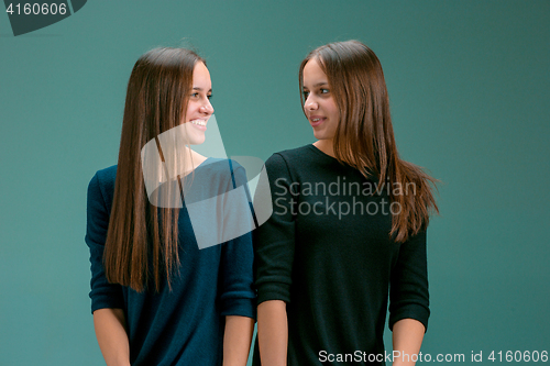 Image of Portrait of two beautiful twin young women