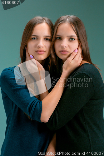 Image of Portrait of two beautiful twin young women