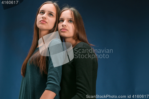 Image of Portrait of two beautiful twin young women