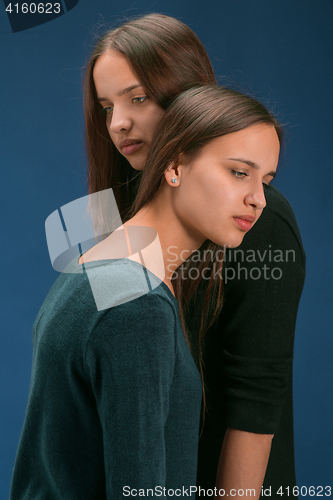 Image of Portrait of two beautiful twin young women