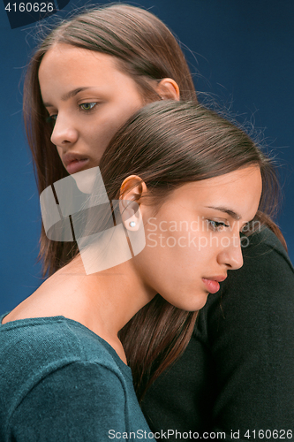 Image of Portrait of two beautiful twin young women