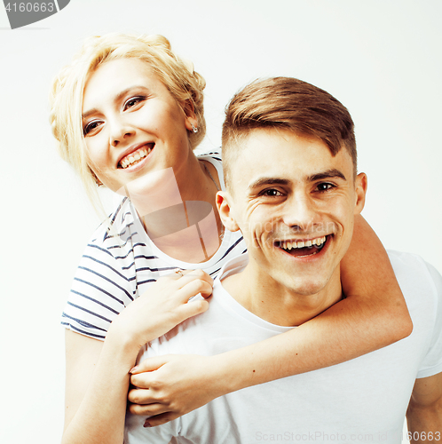 Image of young pretty teenage couple, hipster guy with his girlfriend happy smiling and hugging isolated on white background, lifestyle people concept 