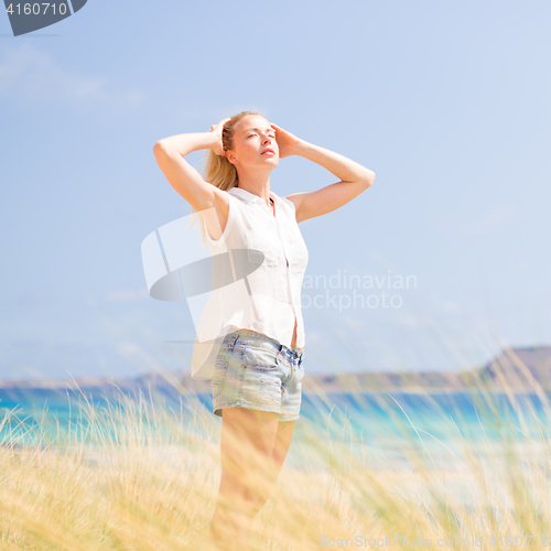 Image of Free Happy Woman Enjoying Sun on Vacations.