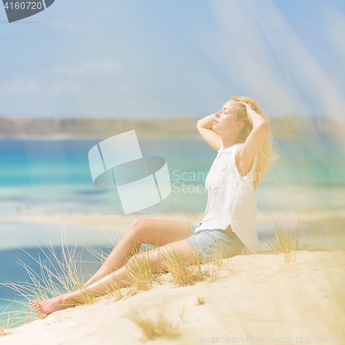 Image of Relaxed Happy Woman Enjoying Sun on Vacations.