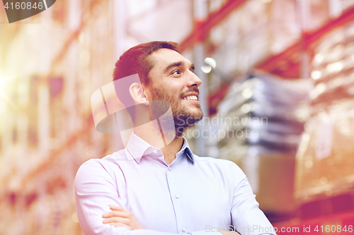 Image of happy man at warehouse