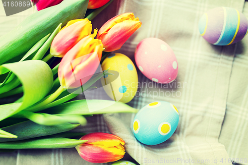 Image of close up of colored easter eggs and flowers