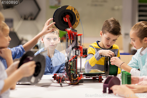 Image of happy children with 3d printer at robotics school