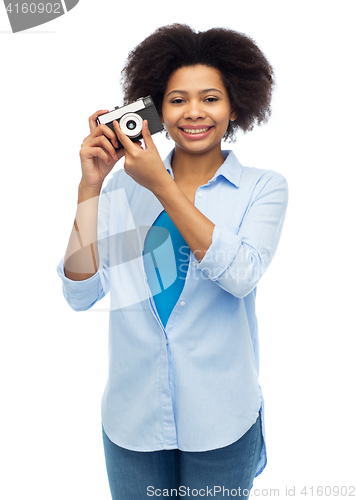 Image of happy african american woman with film camera