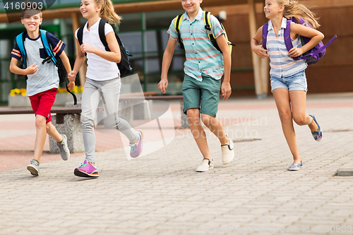 Image of group of happy elementary school students running