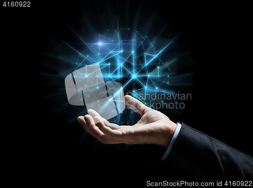 Image of close up of businessman hand with hologram