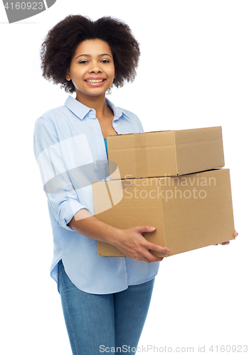 Image of happy african young woman with parcel boxes