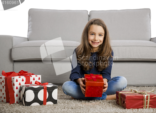 Image of Little girl opening presents