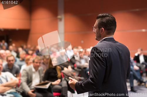 Image of Speaker giving talk at business conference event.