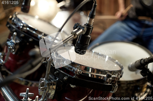 Image of drums and microphone at music studio