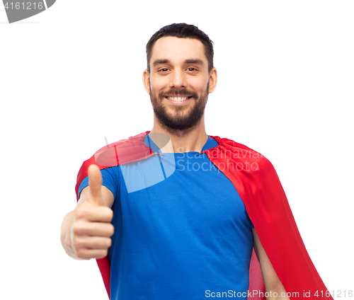 Image of happy man in red superhero cape showing thumbs up