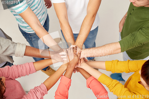 Image of group of international people with hands together