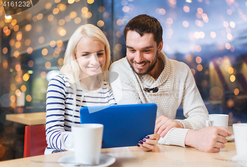 Image of happy couple with tablet pc and coffee at cafe