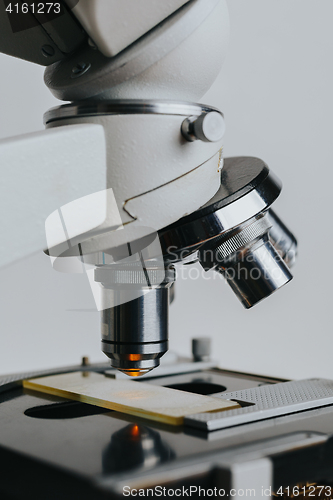 Image of Laboratory Microscope with multiple lenses.