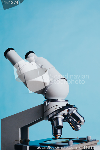 Image of Laboratory Microscope with multiple lenses.