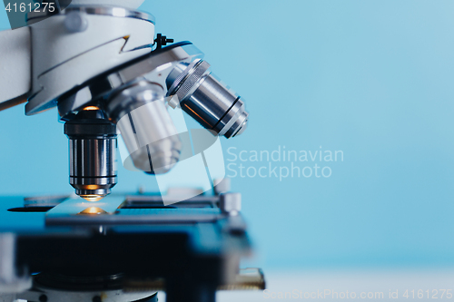 Image of Laboratory Microscope with multiple lenses.