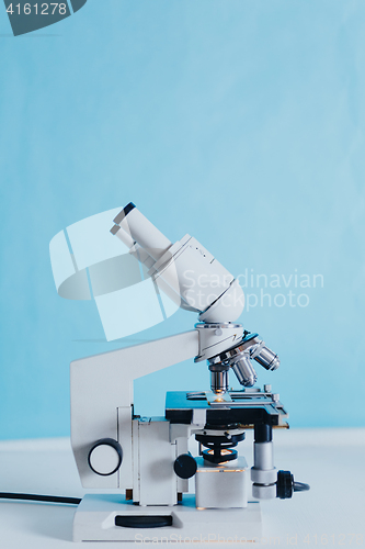 Image of Laboratory Microscope with multiple lenses.