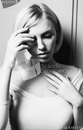 Image of young stylish woman sensual posing with hands on face, black and white lifestyle  sexy people concept