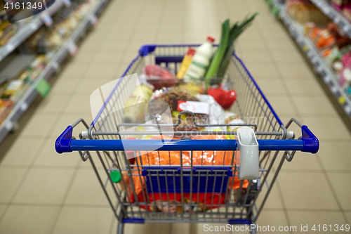 Image of food in shopping cart or trolley at supermarket