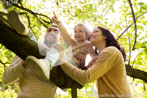 Image of happy family in summer park having fun