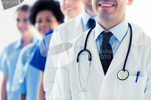 Image of close up of happy doctors with stethoscope