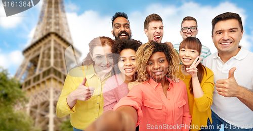 Image of international group of happy people taking selfie