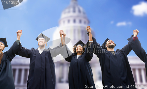 Image of happy students or bachelors celebrating graduation