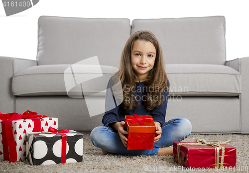 Image of Little girl opening presents