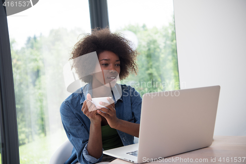 Image of African American woman in the living room