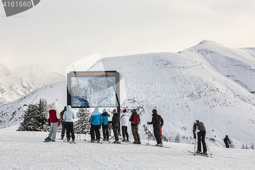Image of Skiers at the Top of the Slope