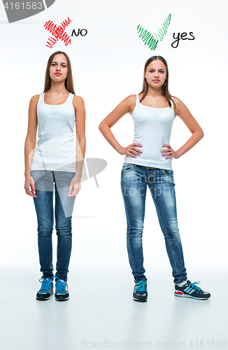 Image of conceptual portrait of two beautiful twin young women