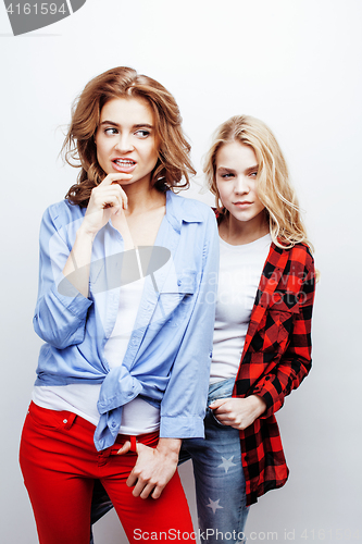 Image of two pretty blond woman having fun together on white background, mature mother and young teenage daughter, lifestyle people concept