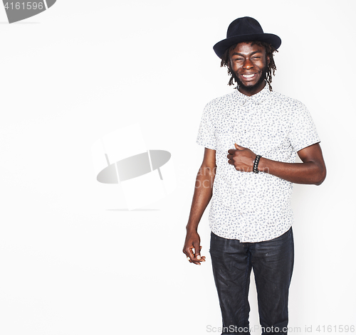 Image of young handsome afro american boy in stylish hipster hat gesturin