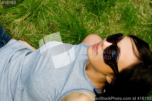 Image of young girl on green grass