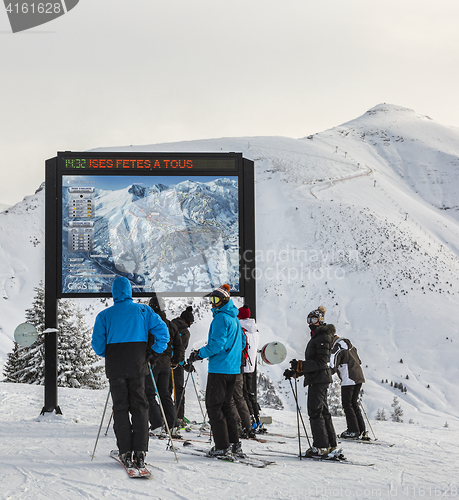 Image of Skiers at the Top of the Slope