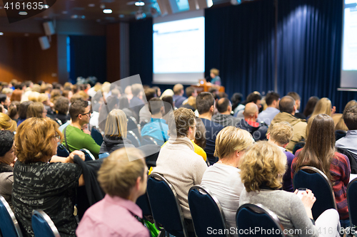 Image of Audience in lecture hall participating at business event.