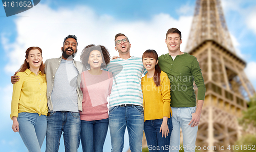 Image of international group of people over eiffel tower